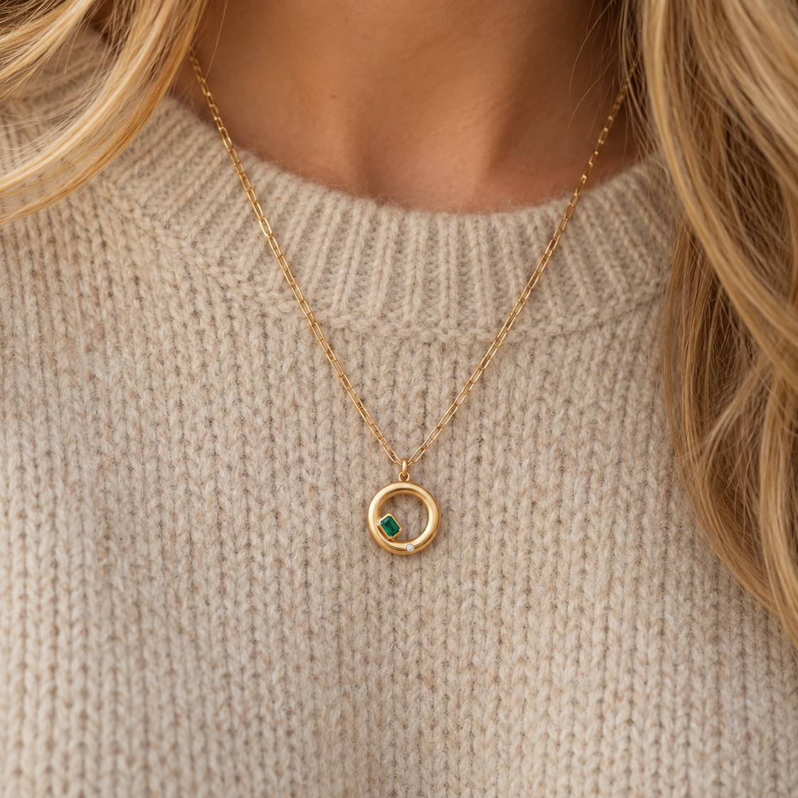 Mini Chloe Necklace in emerald, worn with a beige knit jumper